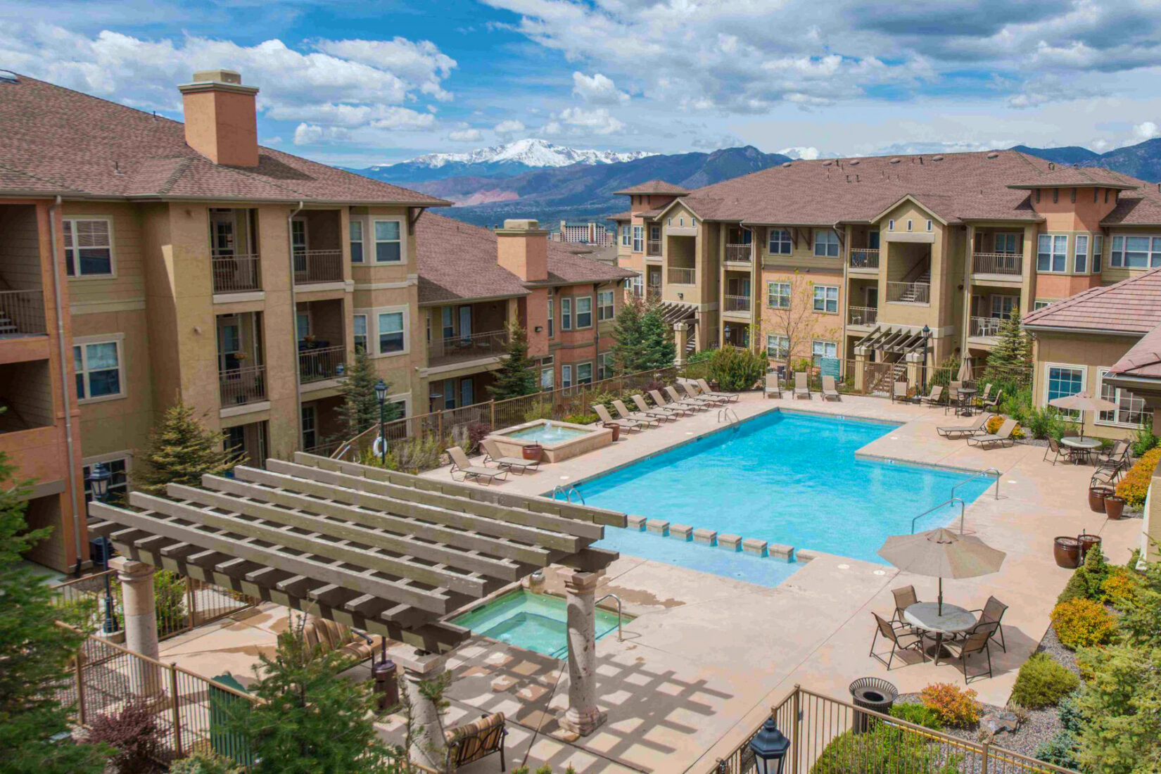 Outdoor Apartment Pool Area with Mountains in the Background