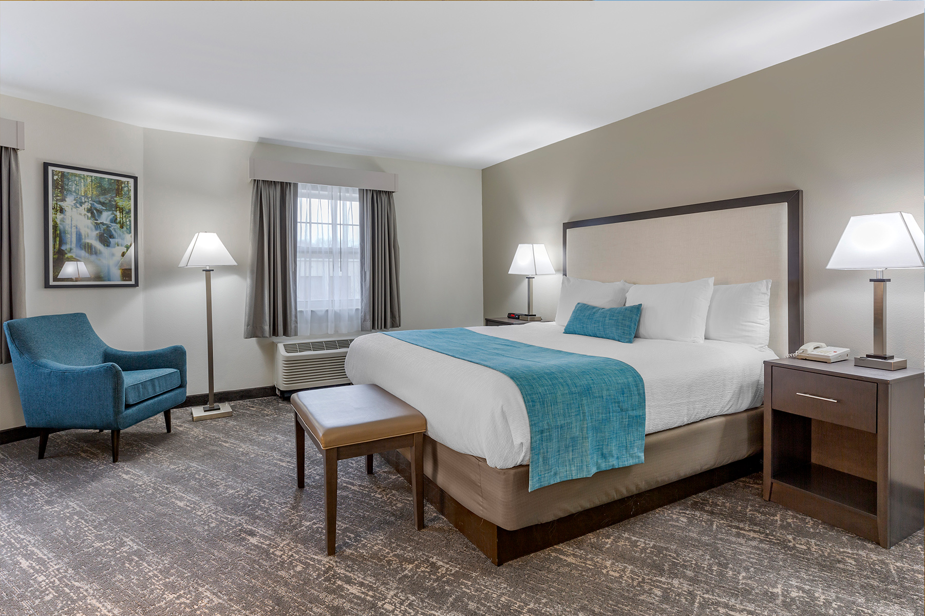 Clean and Simple Hotel Room with Accent Chair