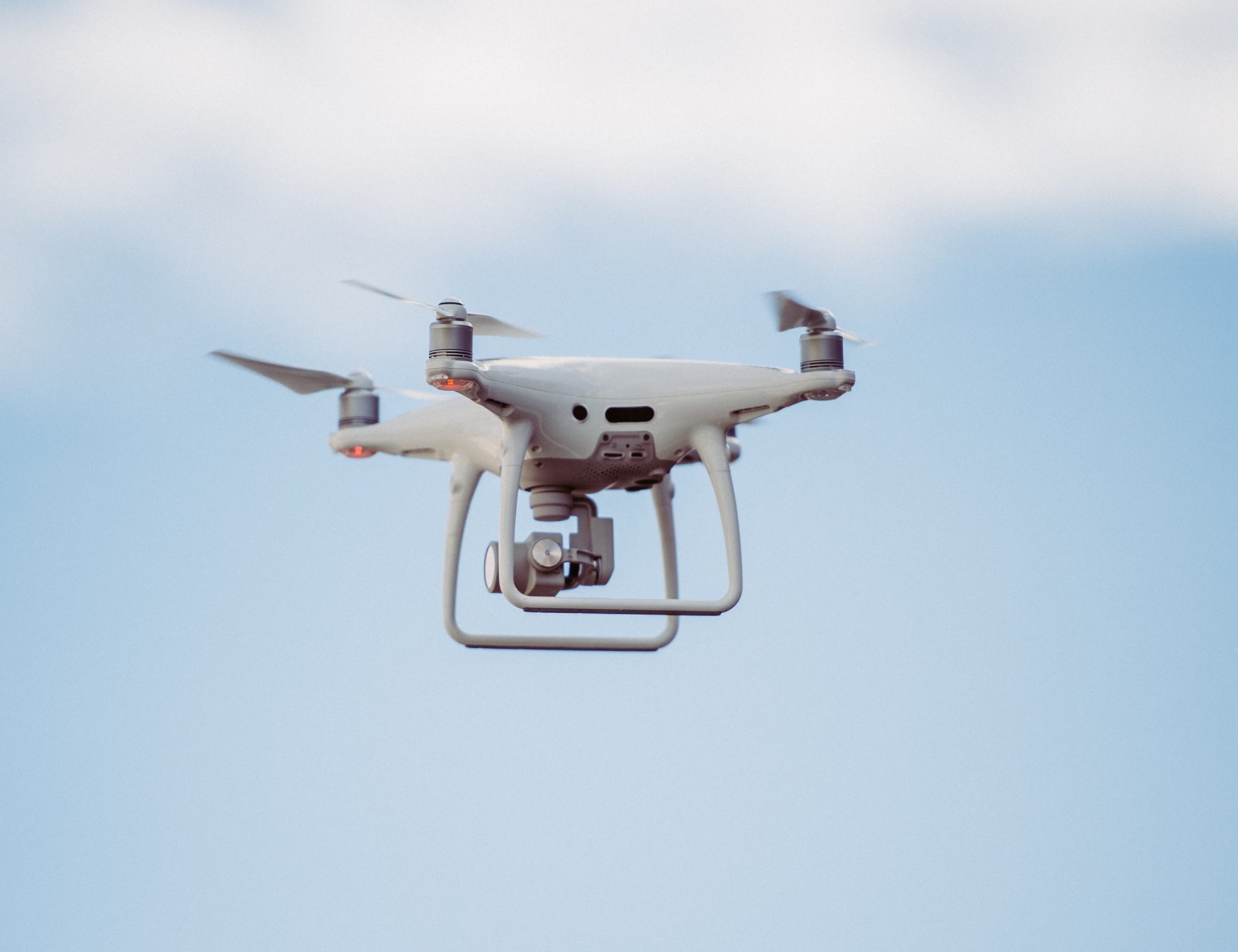 A quadcopter drone flying with a gimbal