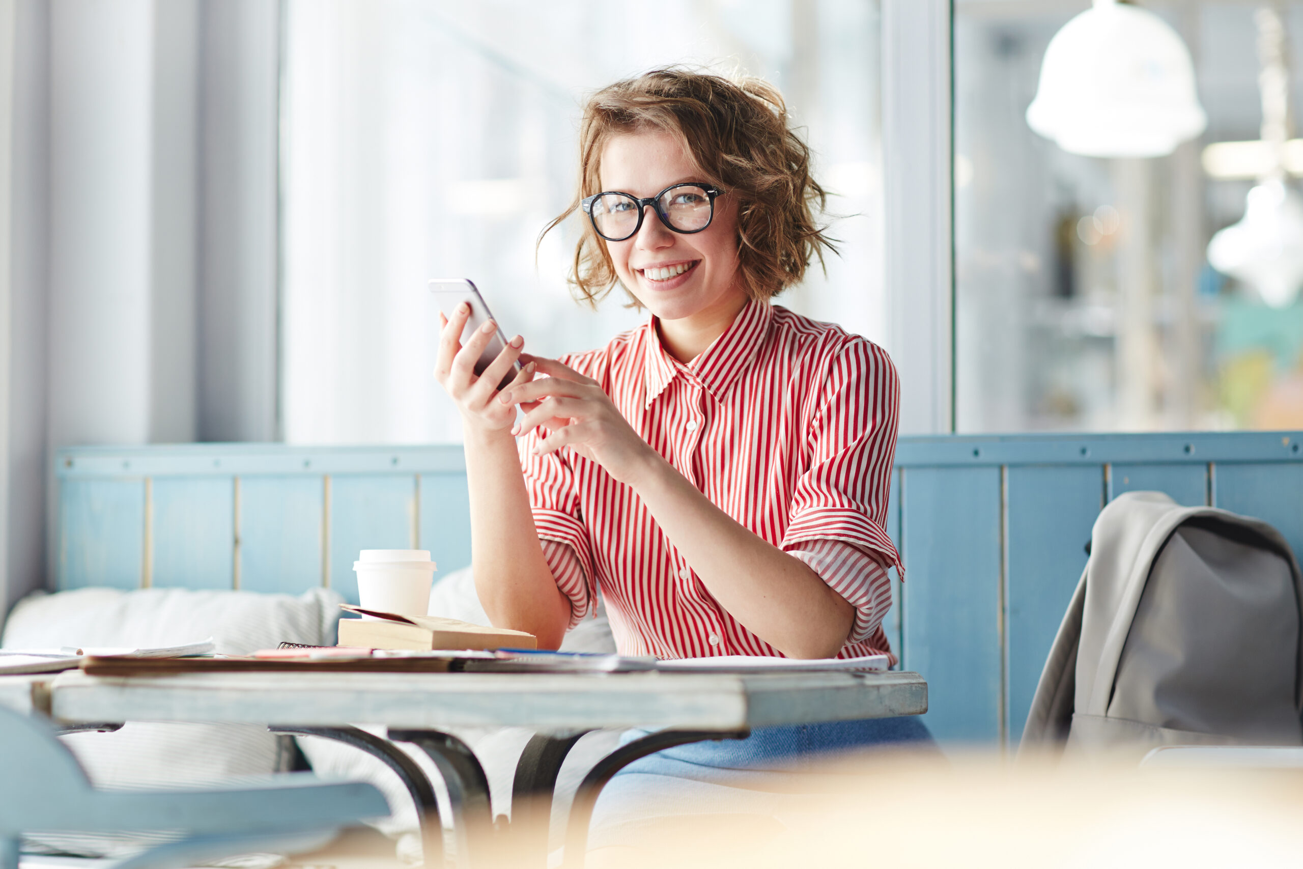 Millennial woman posing with phone