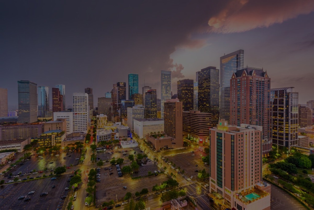 An aerial view of downtown Houston at dusk.