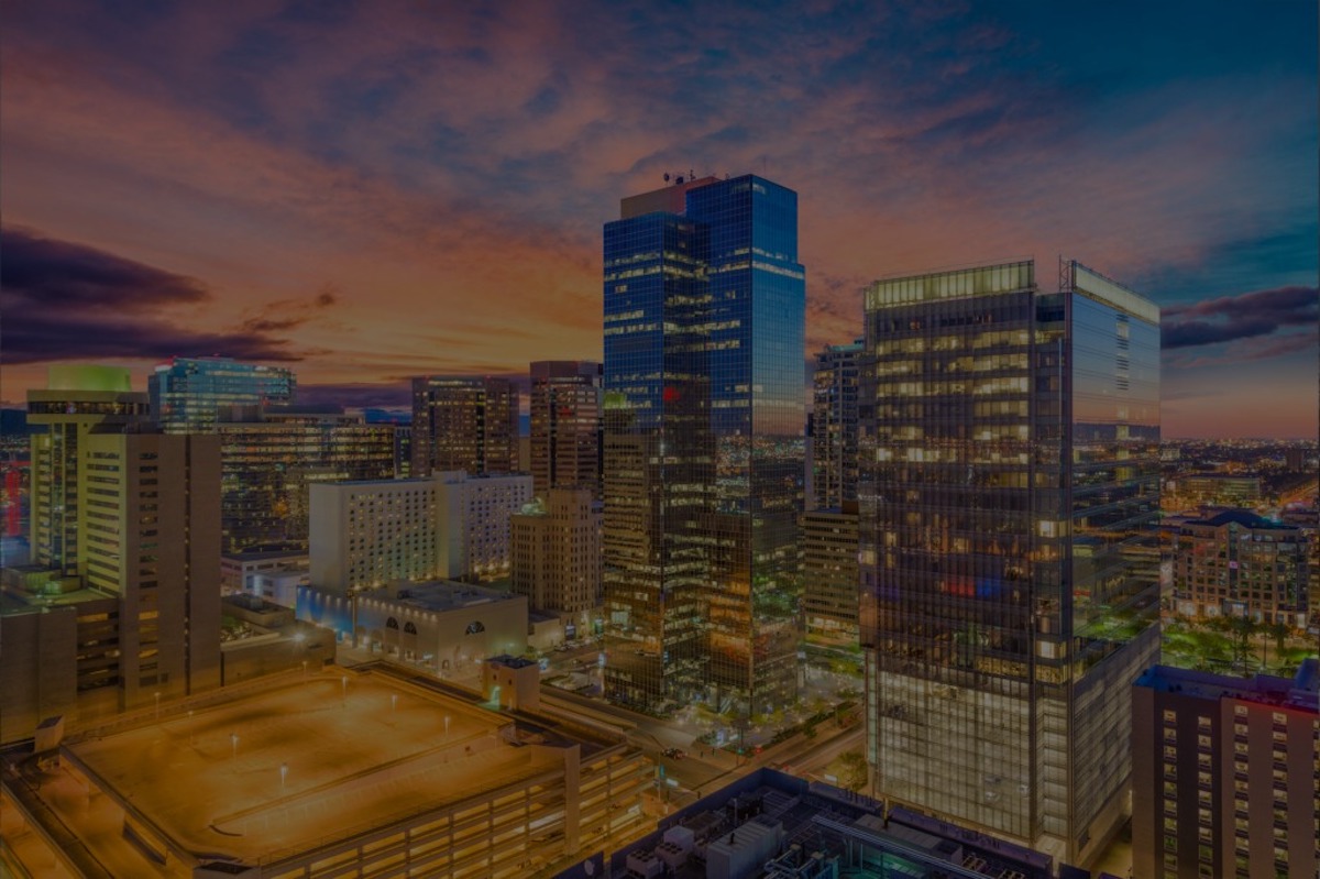An aerial image of downtown Phoenix with a cotton-candy like sky.